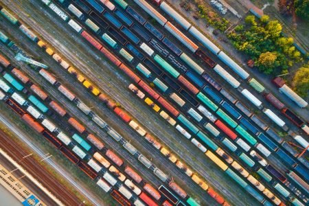 Top view of colorful cargo trains. Aerial view