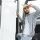 Truck driver climbing into cab of semi-truck