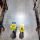 Warehouse workers consult delivery plans using laptop and electronic database